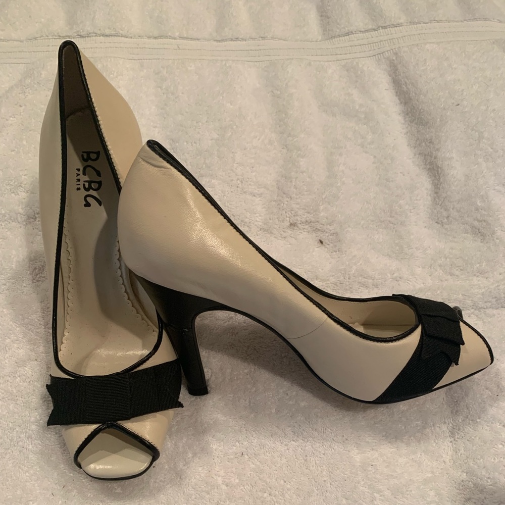 Cream heels with black bow detail